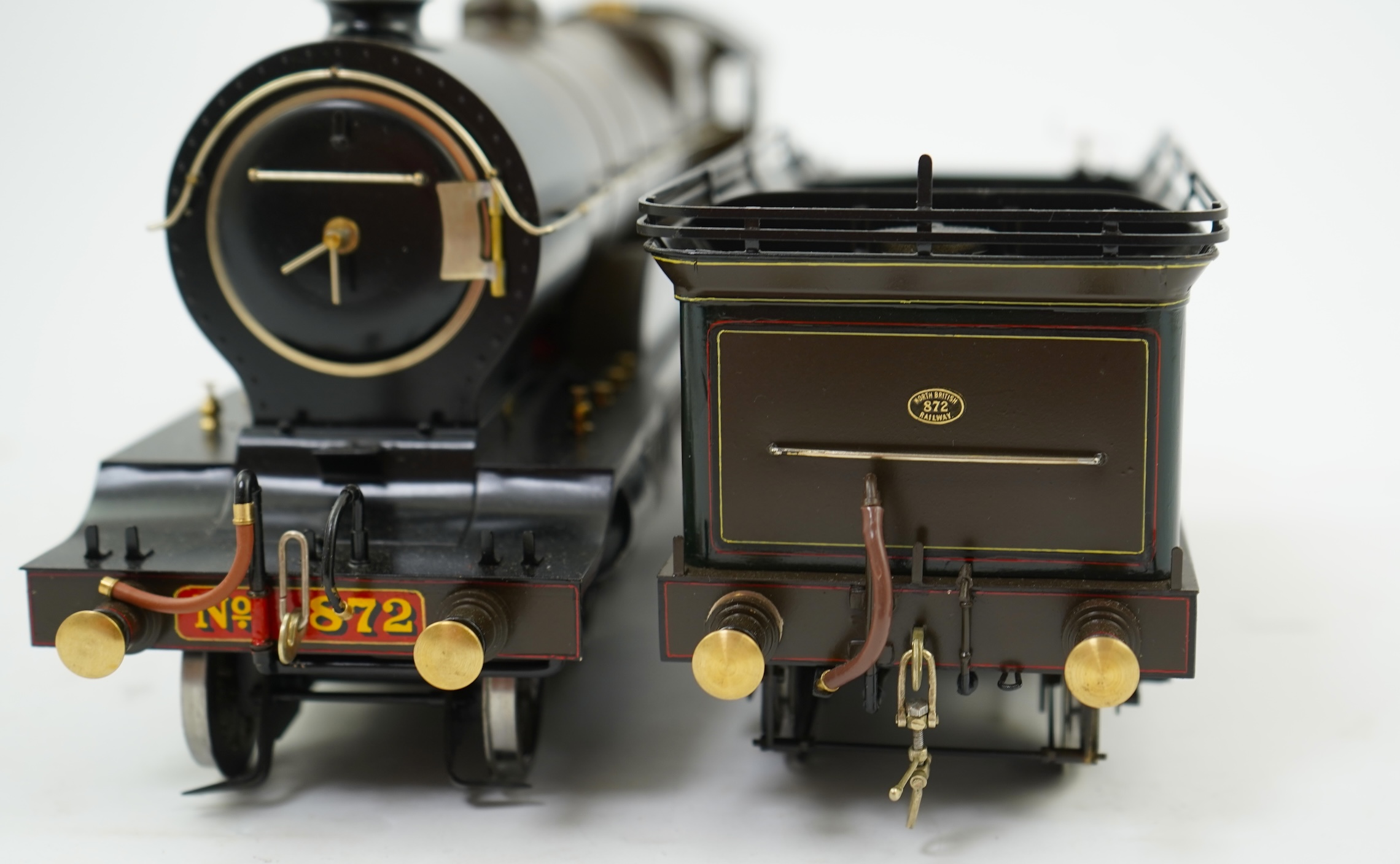A Gauge One model of North British Railways H Class Auld Reekie 872, 4-4-2 Atlantic tender locomotive, the model has been left unpowered to allow for a high level of detailing of the valve gear and cylinders between the